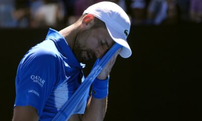 Novak Djokovic retires injured from Australian Open semifinal, as some fans boo : NPR