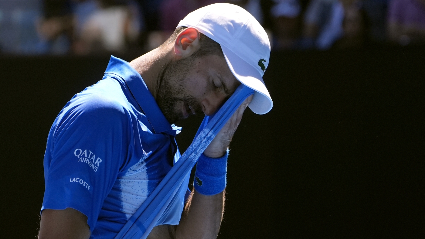 Novak Djokovic retires injured from Australian Open semifinal, as some fans boo : NPR