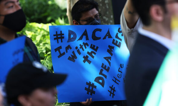 People gather for a rally to celebrate the 10th anniversary of the Deferred Action for Childhood Arrivals program in Battery Park on June 15, 2022, in New York City. (Photo by Michael M. Santiago/Getty Images)