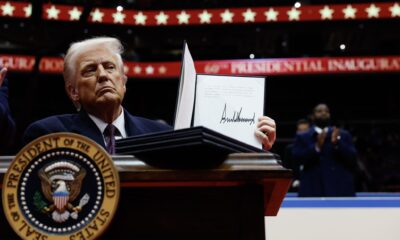 President Donald Trump holds up an executive order after signing it during an indoor inauguration parade at the Capital One Arena on Jan. 20, 2025, in Washington, D.C. (Photo by Anna Moneymaker/Getty Images)